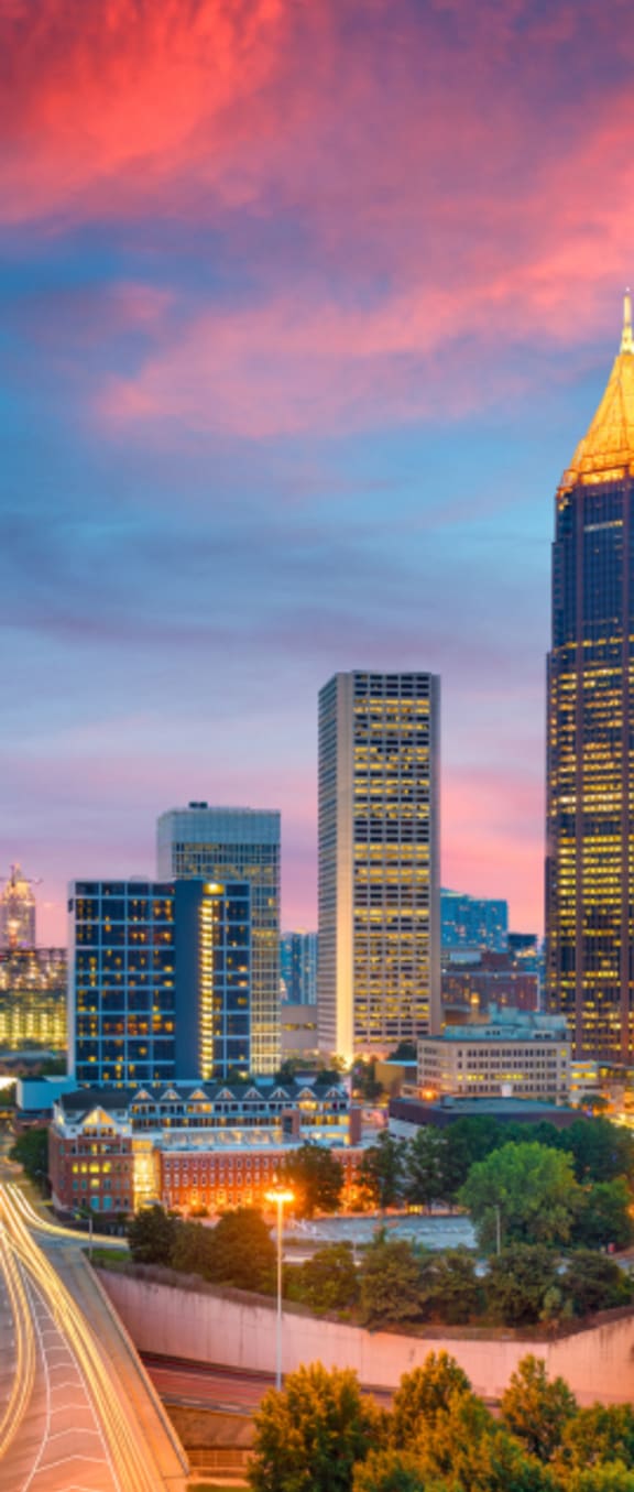 a view of the austin skyline at sunset