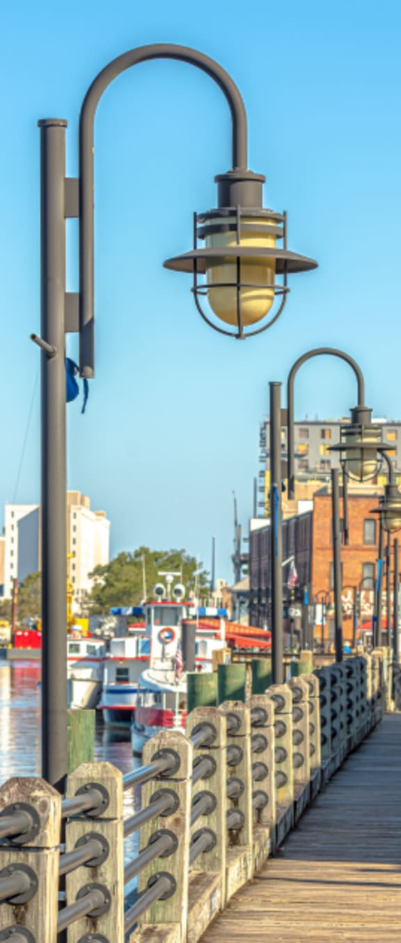 a close up of a street light on a bridge over a body of water at Pendleton Townhomes Apartments, Durham, NC