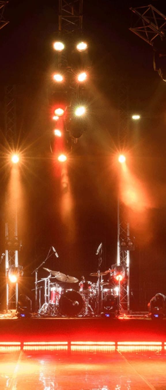 a band is playing on a stage with lights at Carrington Place at Wildewood, Columbia