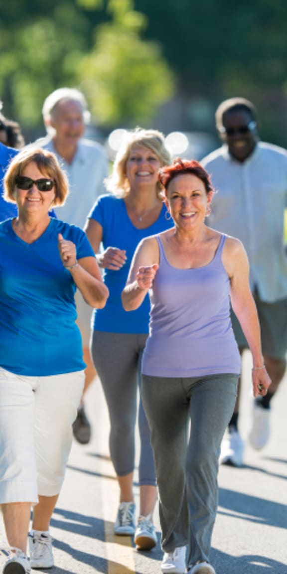 a group of women walking down a street