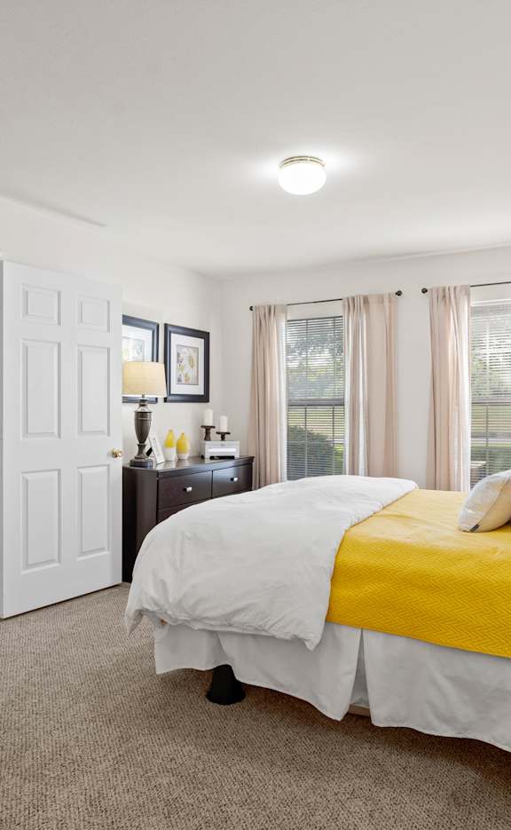 a living room with a couch and coffee table at Stonebriar Woods Apartments, Overland Park, KS
