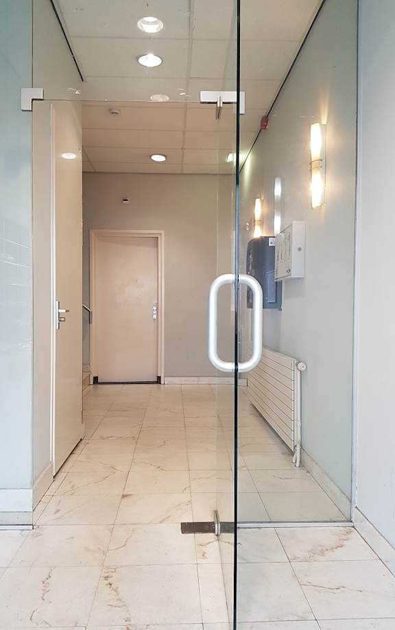 a white bathroom with a sink and a toilet