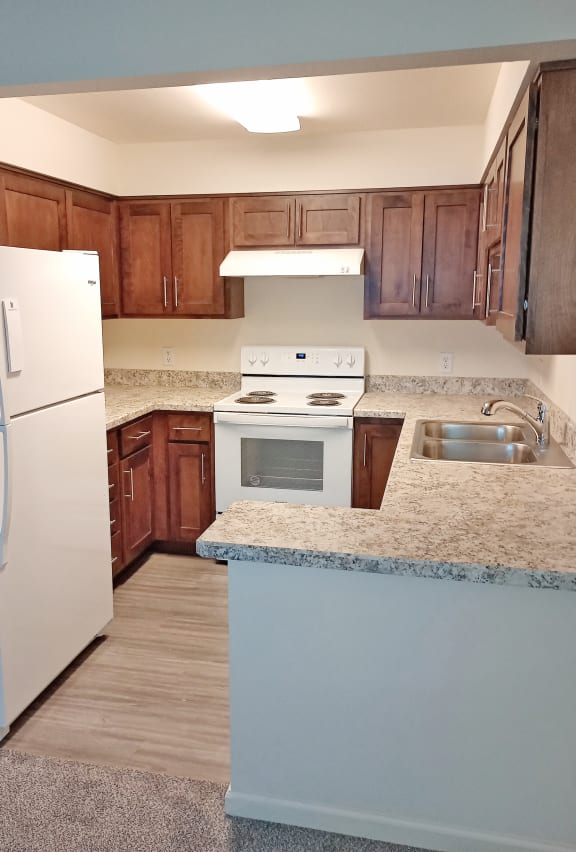 Kitchen with appliances at Rock Creek, Billings