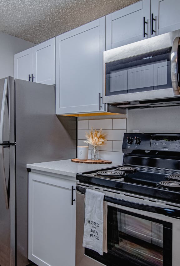 our apartments have a kitchen with stainless steel appliances and a refrigerator