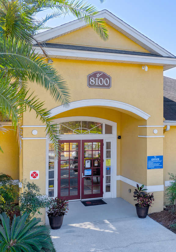 A yellow building with the number 8100 on it.