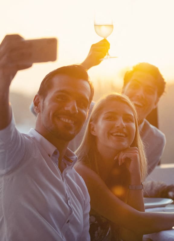 a group of people posing for a picture at a table