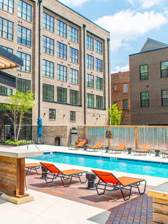 a poolside bar and lounge area at the central apartments near uptown and downtown minneapolis