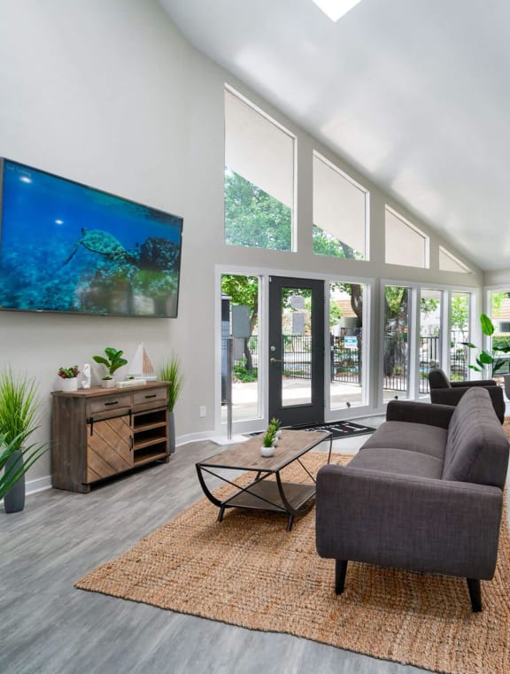a large living room with a kitchen and a dining room