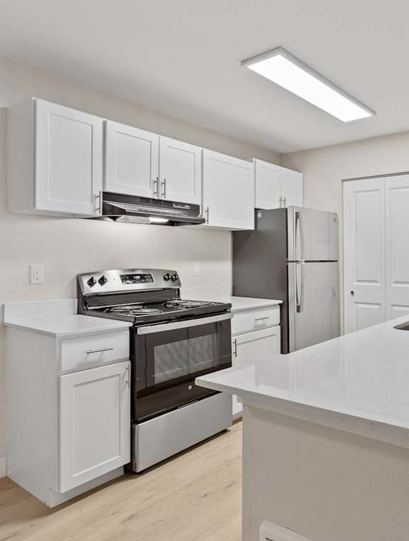A kitchen with white appliances at MonteVista Apartments, Oregon
