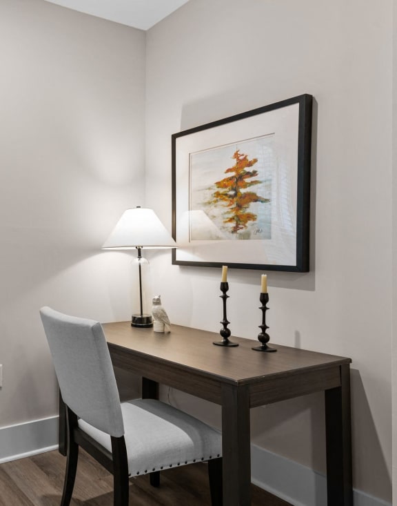 an office with a large window and a desk with a chair