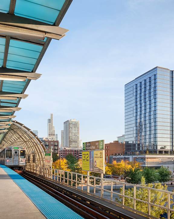 A train station with a train on the tracks.