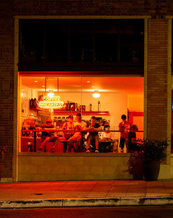 a night time view of the entrance to parks bbq