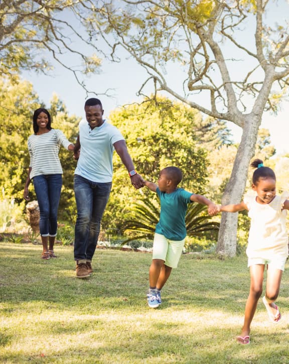 family running together in a park at The Junction at Rogers, Rogers, Arkansas