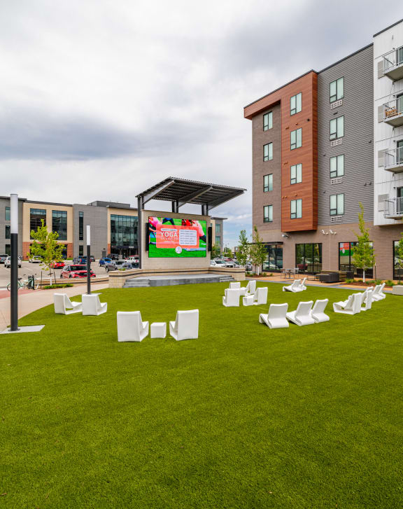 an outdoor patio with a table and chairs in an apartment building at EagleRidge Plaza Residences, North Dakota, 58104