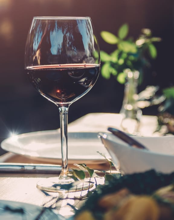 a table with glasses of wine on it