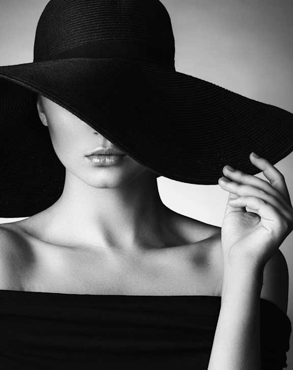 A woman in a black dress and hat at Northridge Gardens Apartments, California, 91325