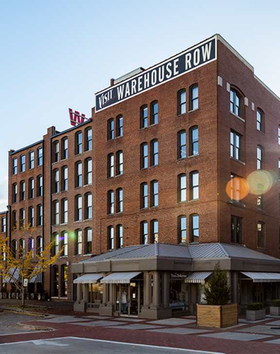A large brick building with the words "Warehouse Row" on the top.