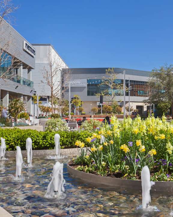 A large building with a fountain in front of it.