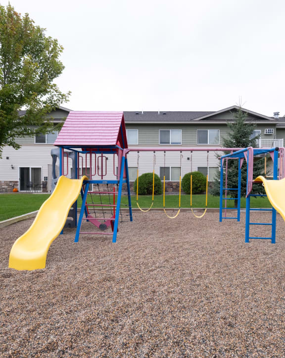 our apartments have a playground with slides and a swing set