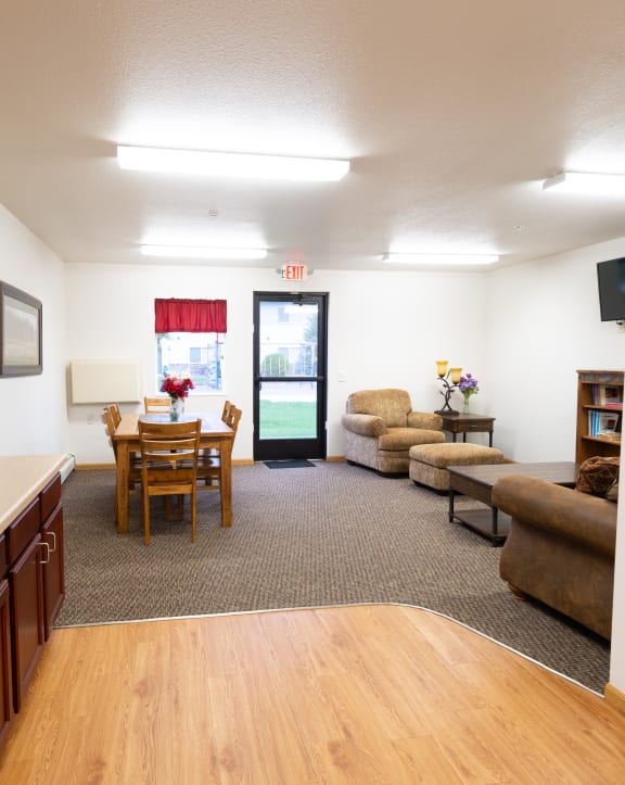 a living room with a kitchen and a dining room