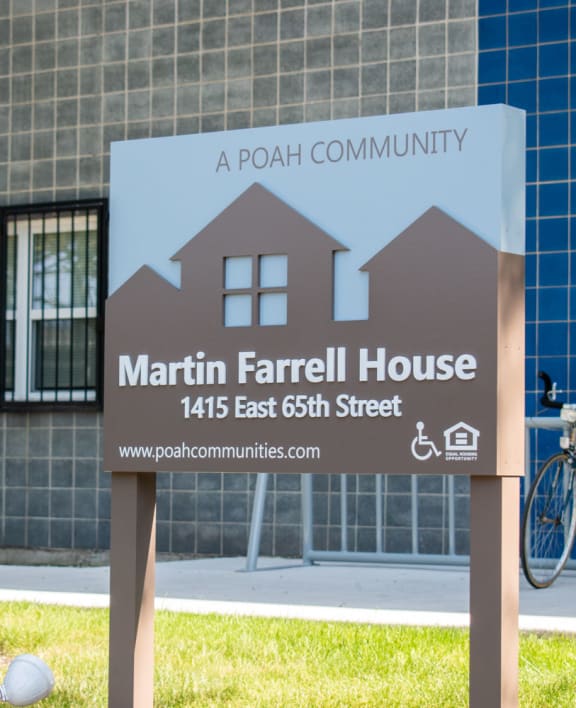 a sign in front of a building that says marin farrell house