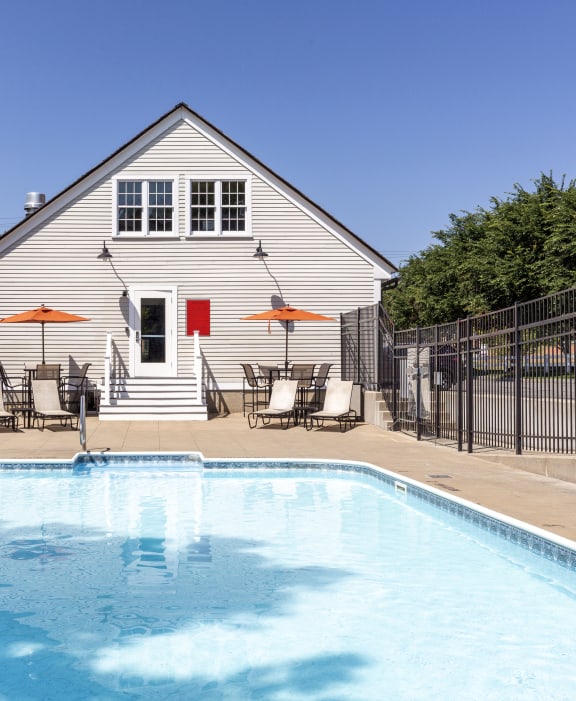 the pool is in front of the house
