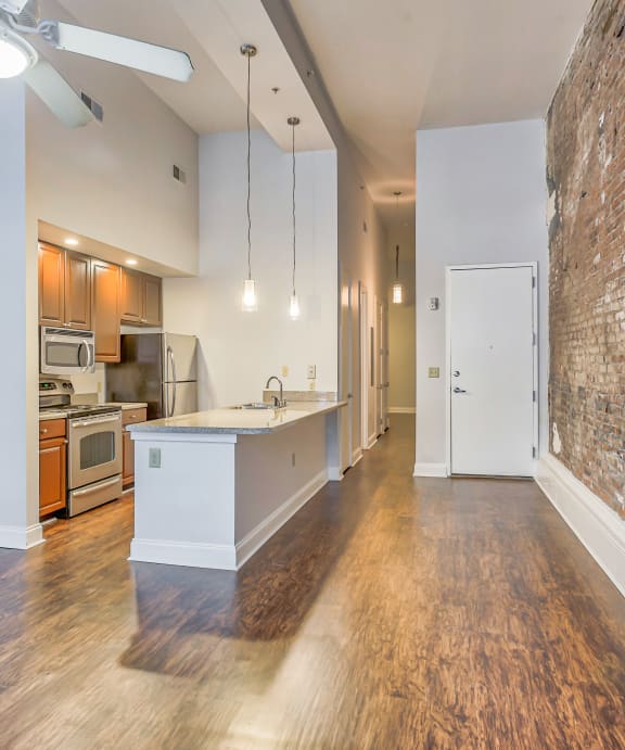 a kitchen and dining area in a 555 waverly unit