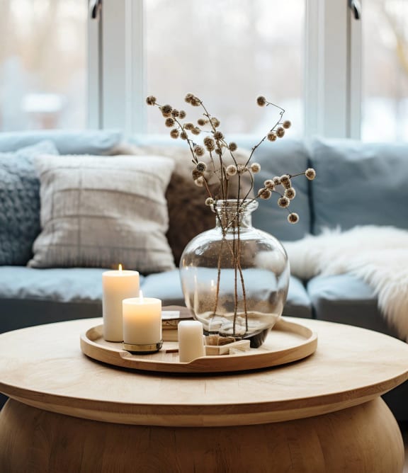 an open living room with couches and a fireplace