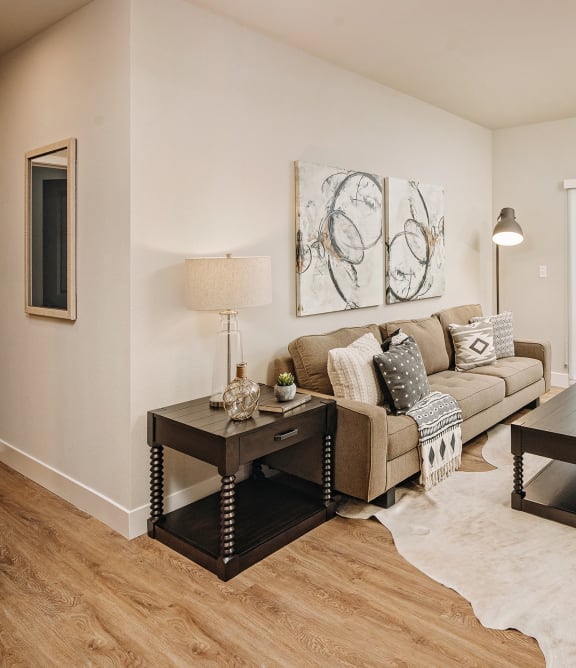 a living room with a couch and a table at 44 West Luxury Living, Valley Park, 63088