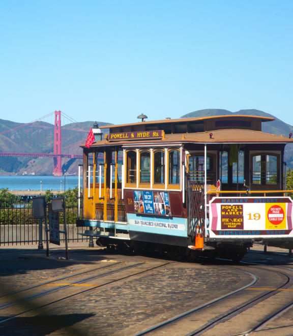 a view of the golden gate bridge from the san francisco cable cars