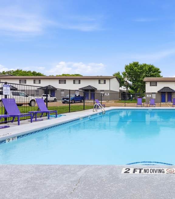 A large swimming pool with the depth indicated as 2 FT.