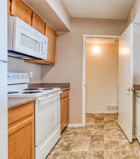 a kitchen with a sink and a stove and a microwave