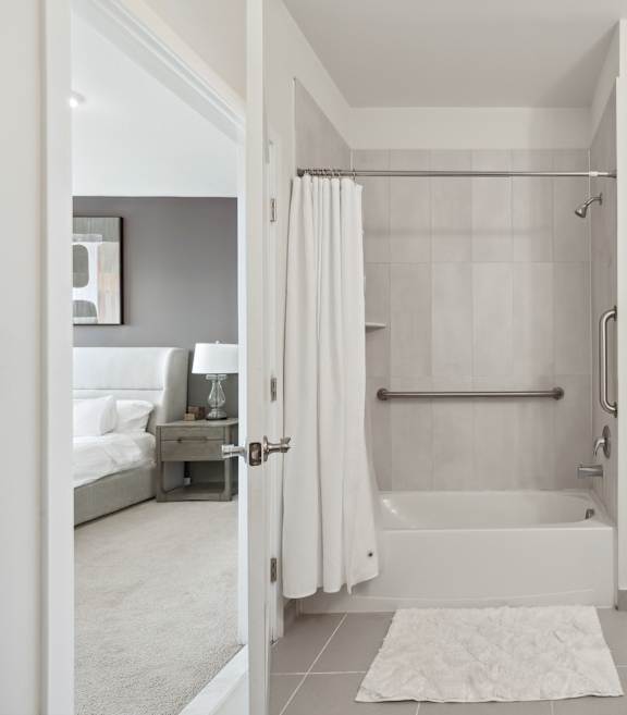A bathroom with two sinks and a mirror.