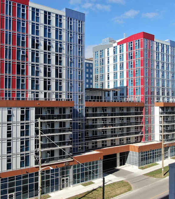 A large multi-story building with red and white stripes.