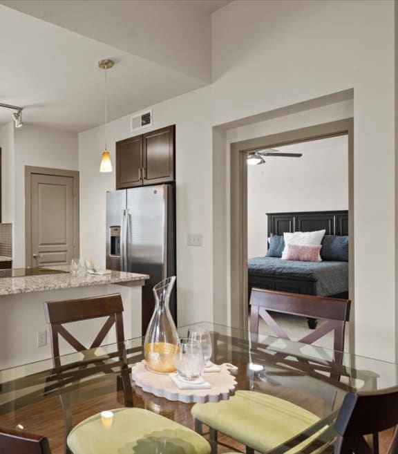 a kitchen and dining area in a 555 waverly unit