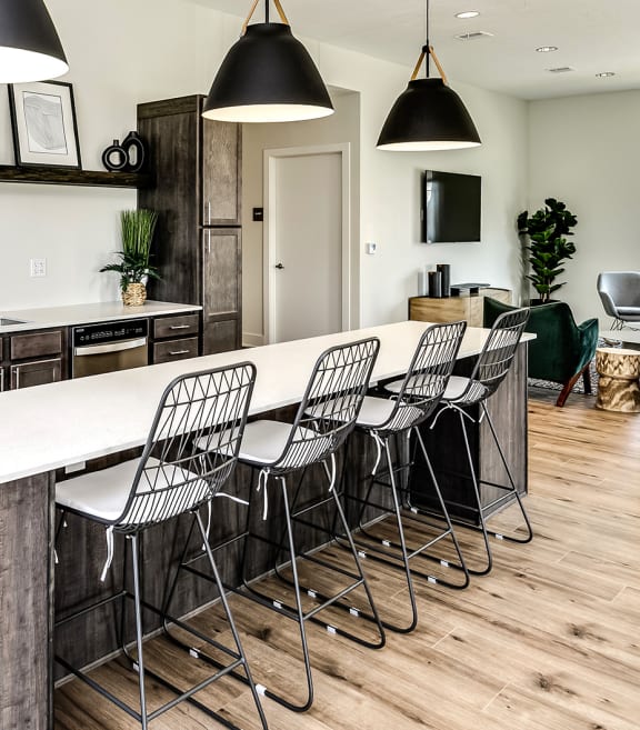 a view of the kitchen and living room from the dining area