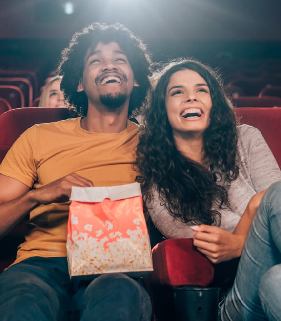 people laughing at a movie theater