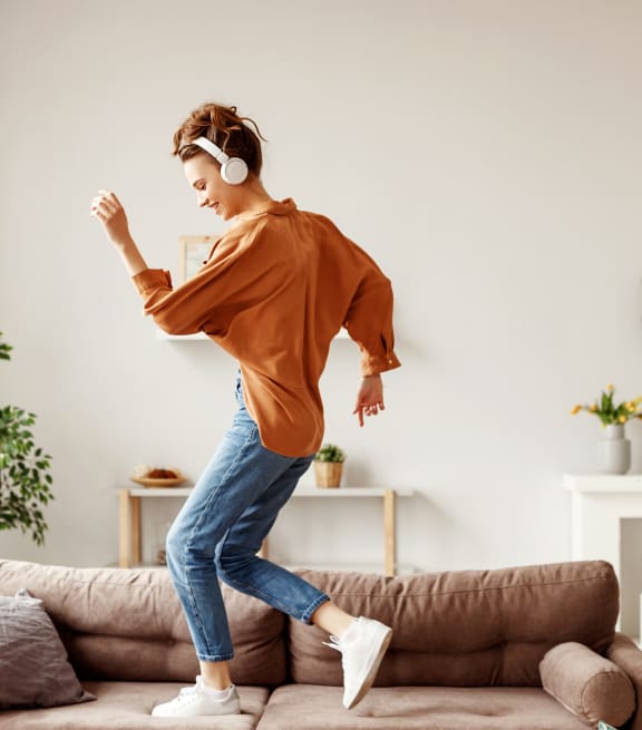 Woman listening to music and dancing at THE ARLO, Citrus Heights, CA, 95621