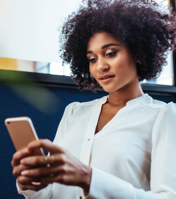 a woman looking at her cell phone at Connect on Missouri, Arizona, 85015