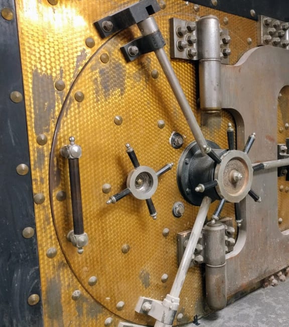 a large yellow and black train engine in a room at Studebaker Lofts, South Bend, IN, 46601