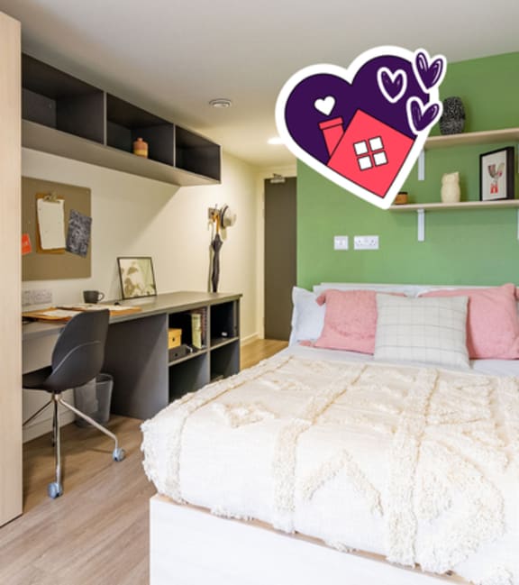 A bedroom with a bed, desk, and chair.