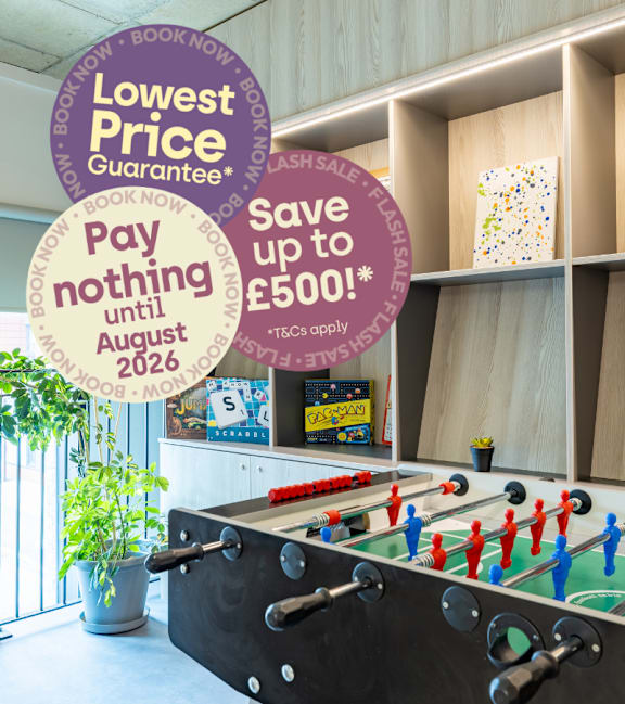 A laundry voucher for £350 is advertised on a circular sign in a room with tables and chairs.