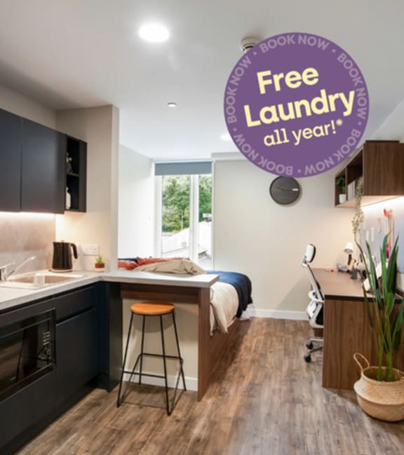 A kitchen with a sign offering a free laundry pass for a year.