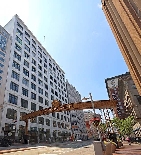 A street view of Playhouse Square with a large building in the background.
