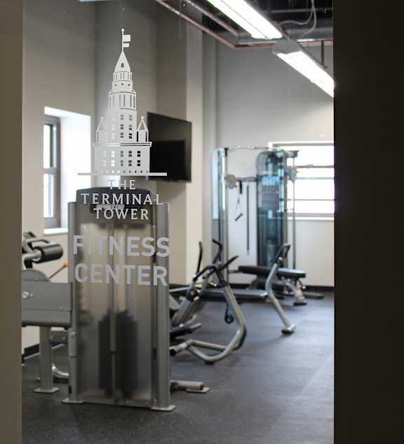 A gym with a sign that says "Terminal Tower Fitness Center".