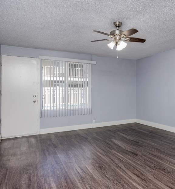 A kitchen with a refrigerator, dishwasher, and a washing machine.