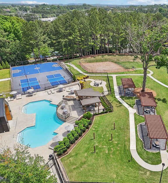 A residential area with a swimming pool and tennis court.