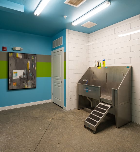 a kitchen with a sink and a stove in a room