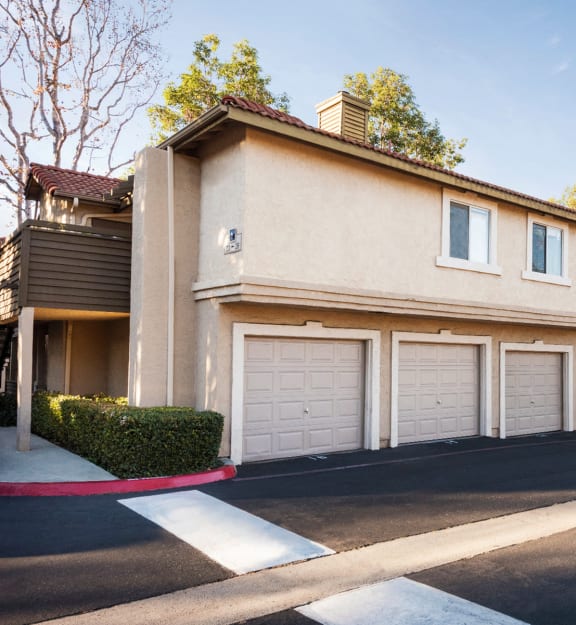 a row of townhomes with garages