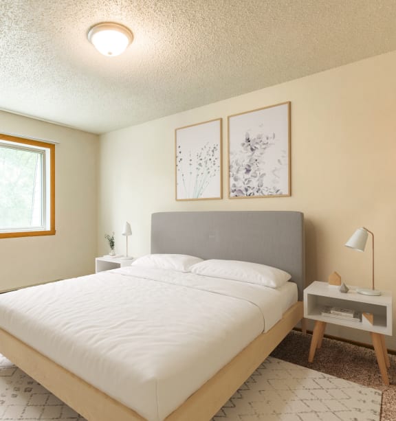 Bismarck, ND Brandon |a bedroom with a white bed and a window Bismarck, ND Brandon |a bedroom with a white bed and a window